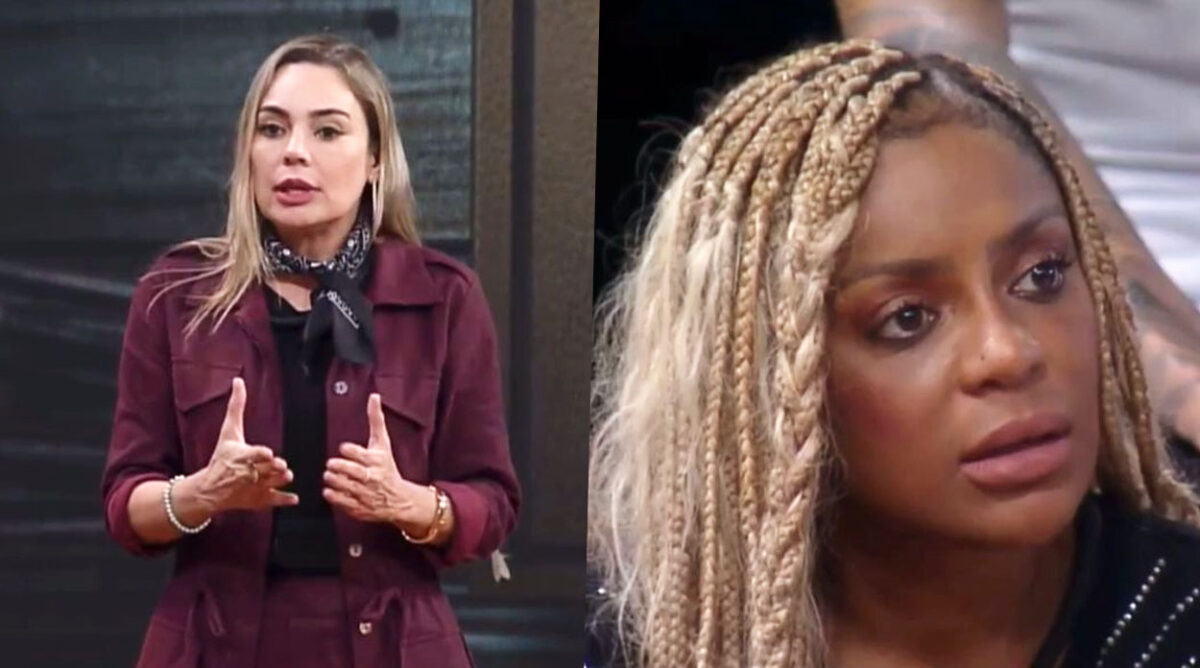 Rachel Sheherazade usando camiseta, sobretudo e saia durante dinâmica em A Fazenda 15. Ao lado dela, Cariúcha, usando tranaçs loiras no cabelo.